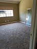 master bedroom with ceiling fan and new shower doors.jpg